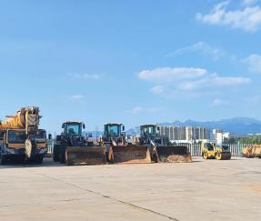 Newly used wheel loader and truck mounted crane waiting for refurbishment